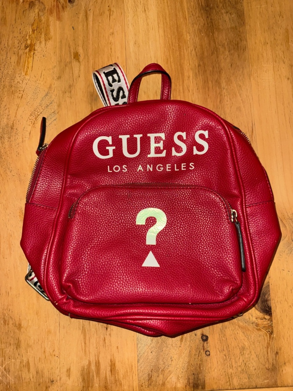 GUESS Los Angeles Izzy Red Pebbled Leather Backpack Question Mark Logo